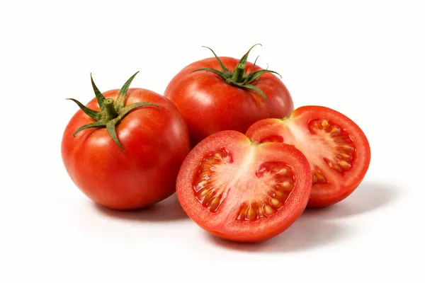 Ripe red tomatoes, whole and halved